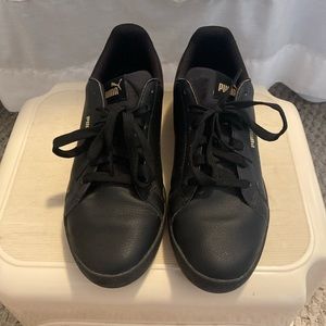 Black and gold size 8 puma sneakers